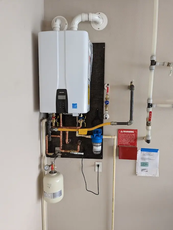 Professional plumber installing copper piping in a Easley home
